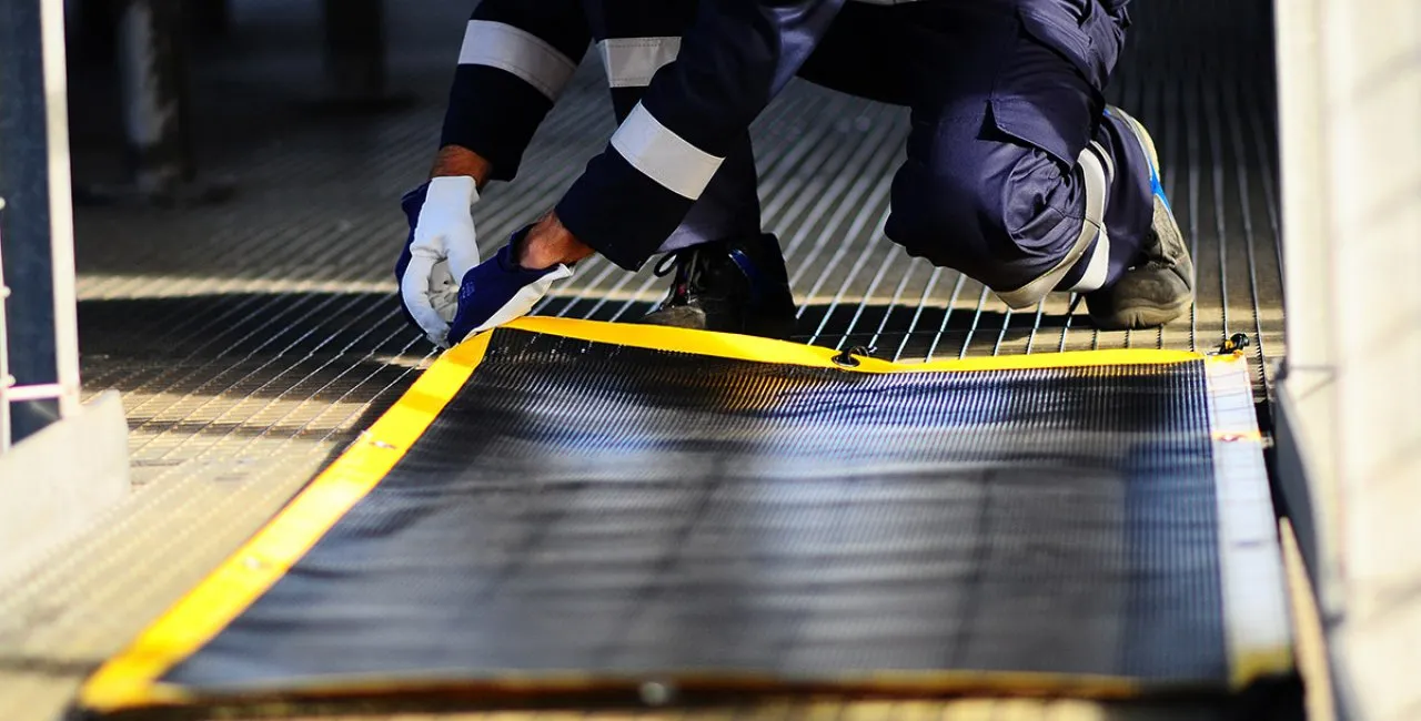 Dropped object prevention mat for working at heights safety